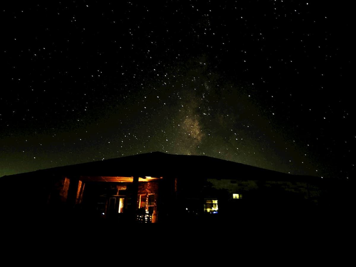 Dark night sky with the Milky Way over Porter Haus